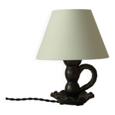 Lampe en céramique noire formant bougeoir