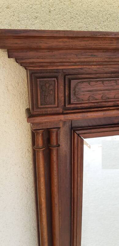 Henri II trumeau mirror for a fireplace in solid walnut.