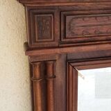 Henri II overmantel fireplace mirror in solid walnut.
