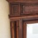 Henri II trumeau mirror for a fireplace in solid walnut.