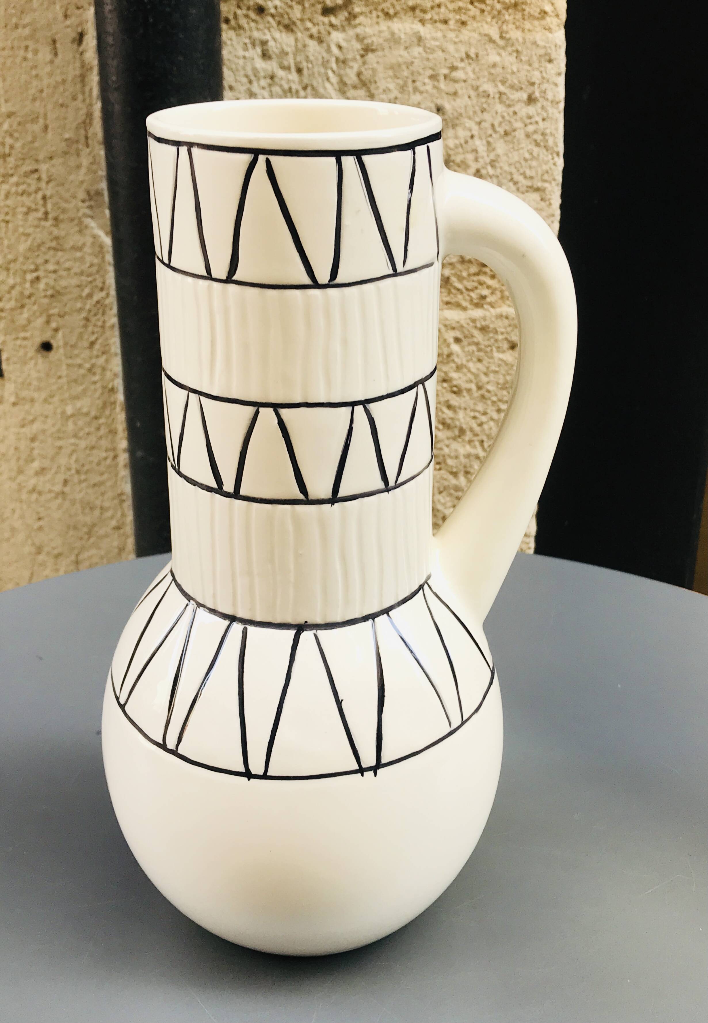 Vase with geometric pattern handles