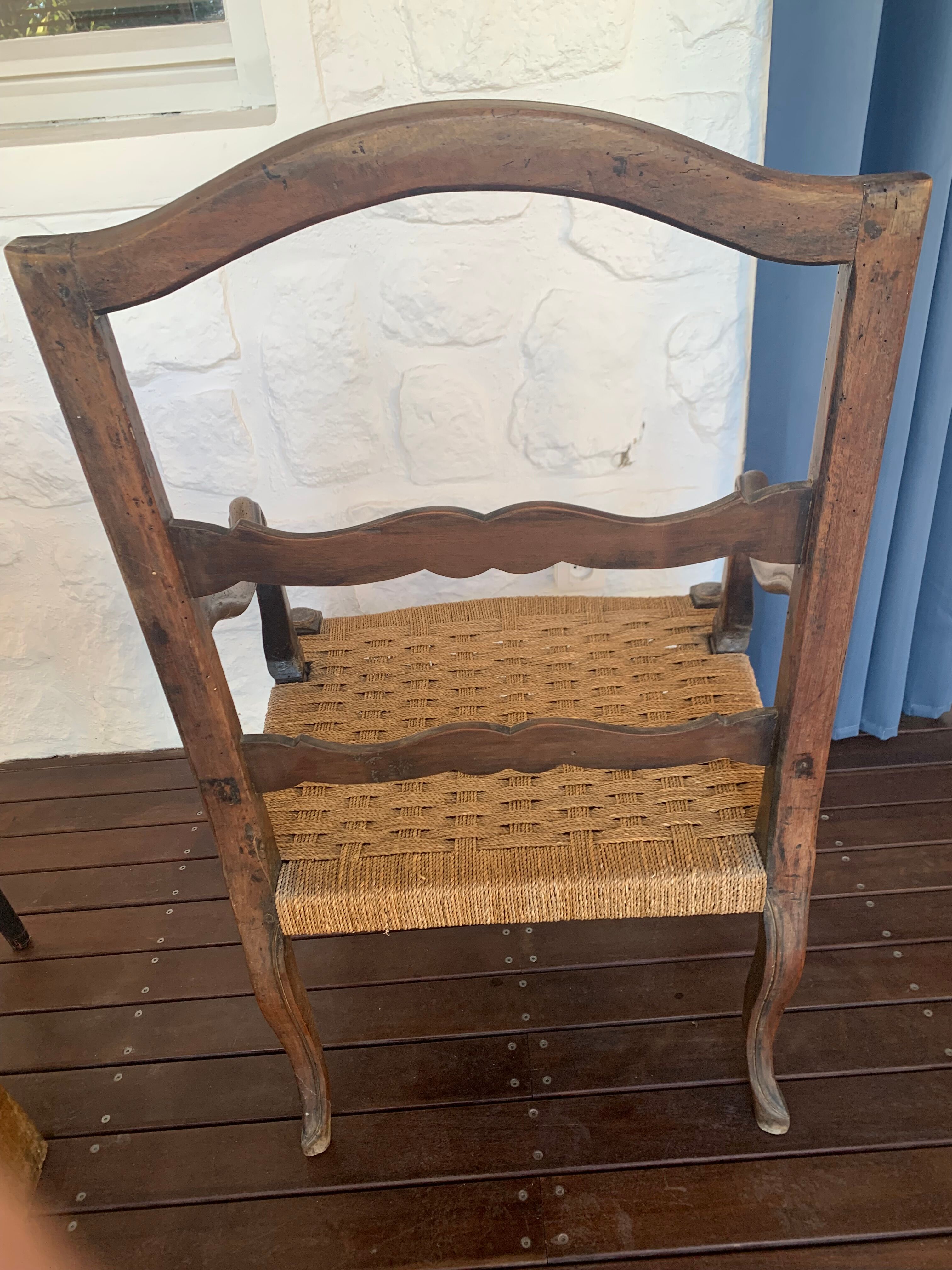 Pair of Louis XV style armchairs in walnut with rush seating.