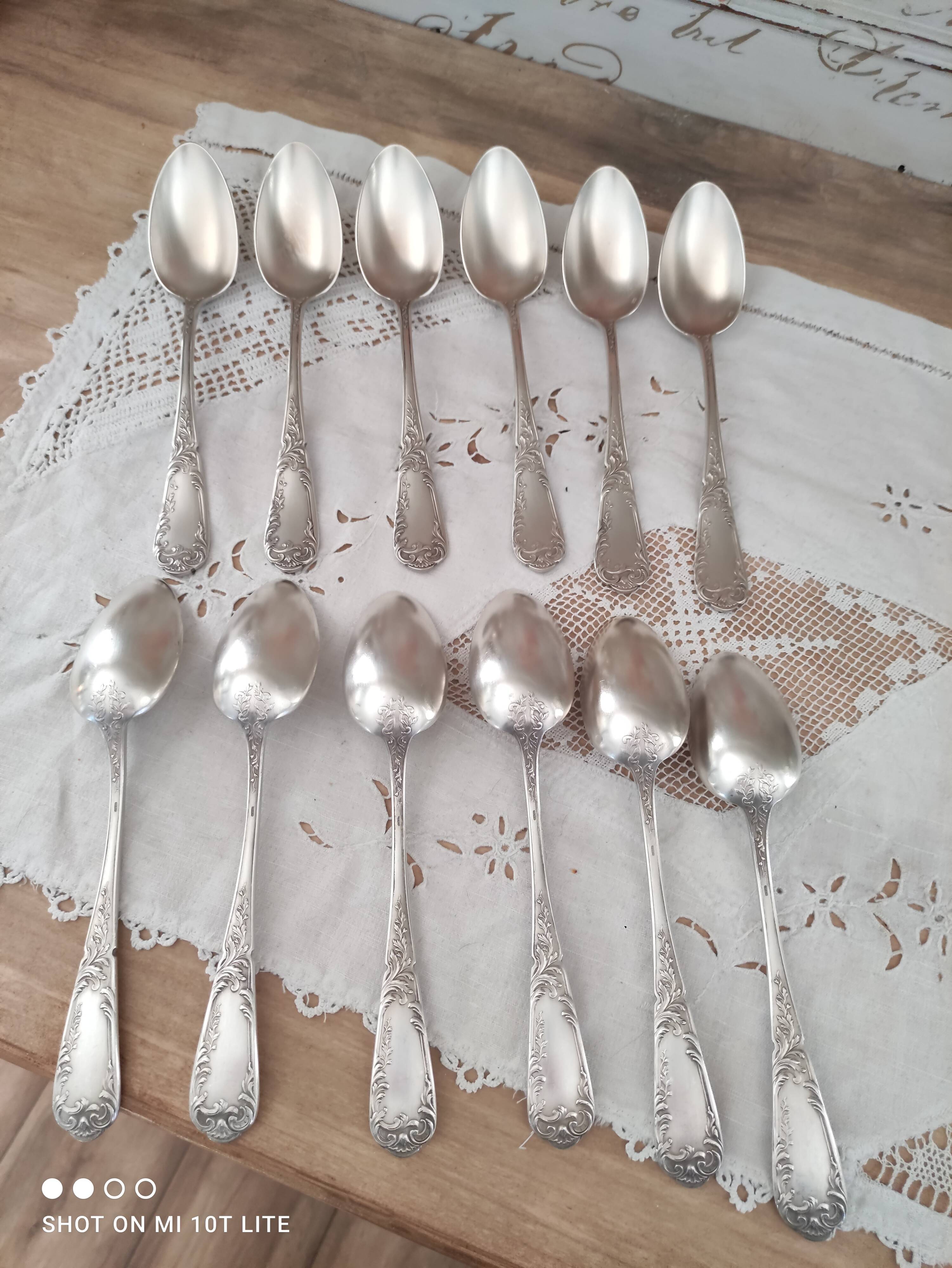 Set of 12 old silver-plated soup spoons