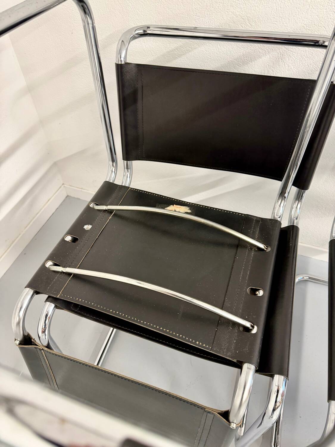 Lot of 4 tubular chairs designed by Mart Stam in vintage black leather from the 1980s.