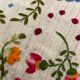 Cushion in hand-embroidered hemp.