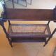 Magazine/book rack in oak with a caned top - early 20th century