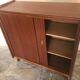 Vintage storage cabinet teak veneer sliding door compass feet