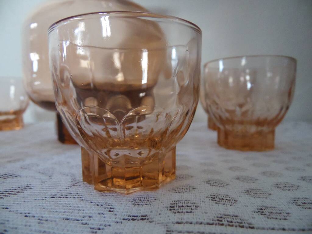 Pink glass liqueur carafe and 6 matching glasses