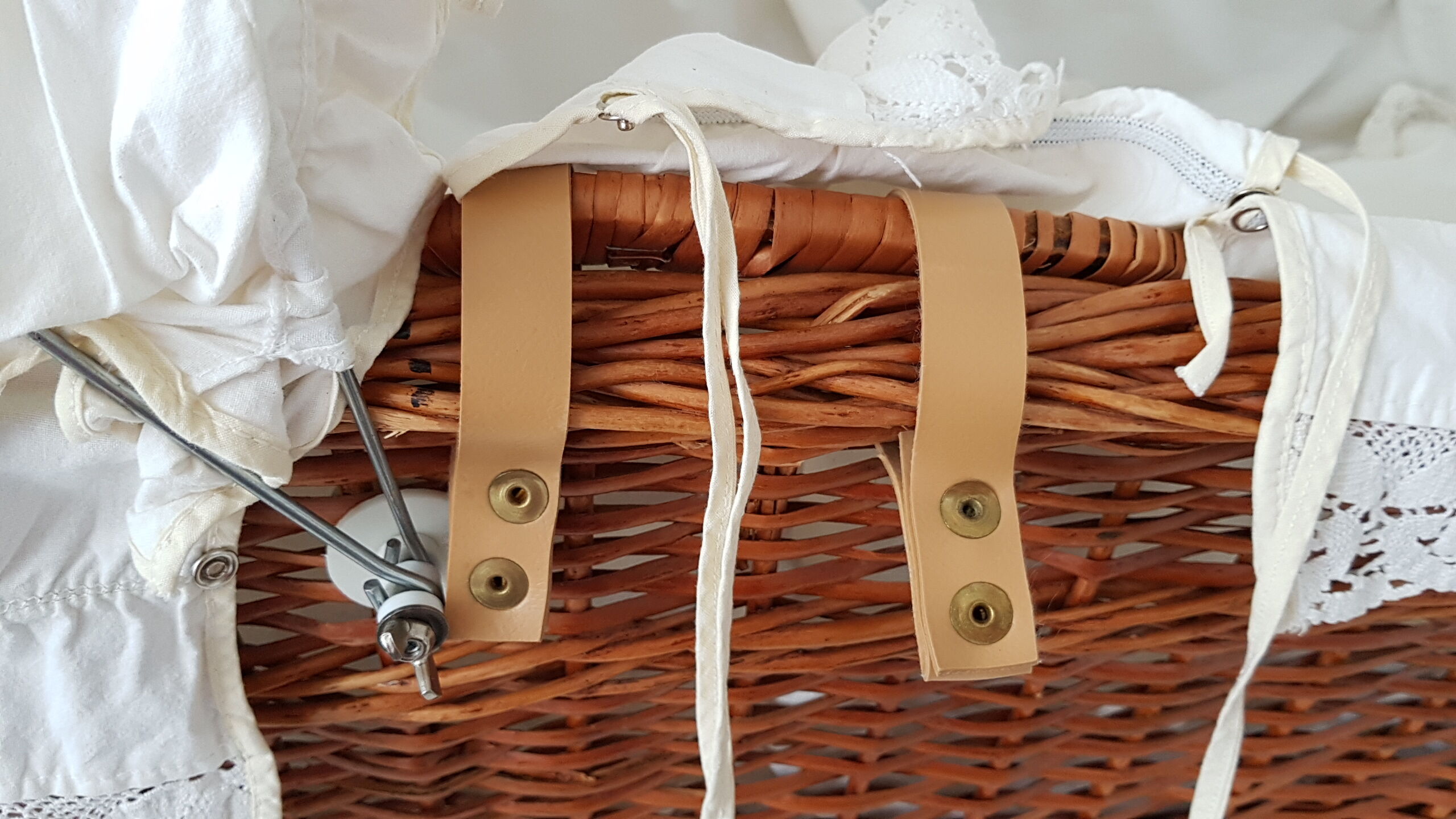Old rattan bassinet and bedding