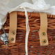 Old rattan bassinet and bedding