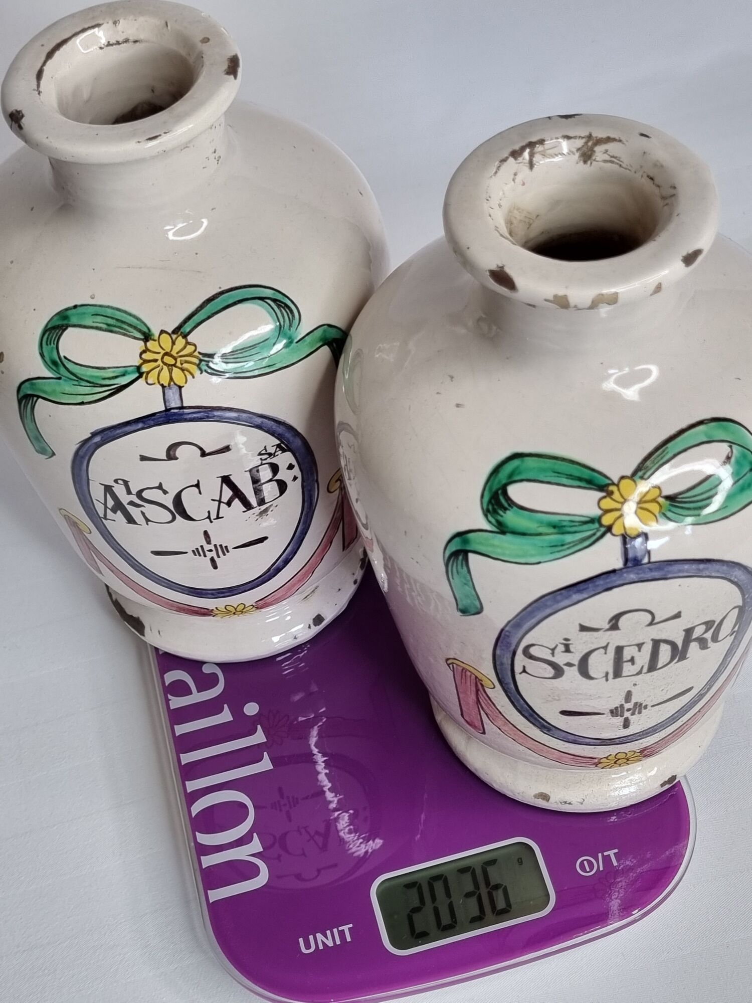 Pair of antique apothecary pots in glazed ceramic, decorated by hand