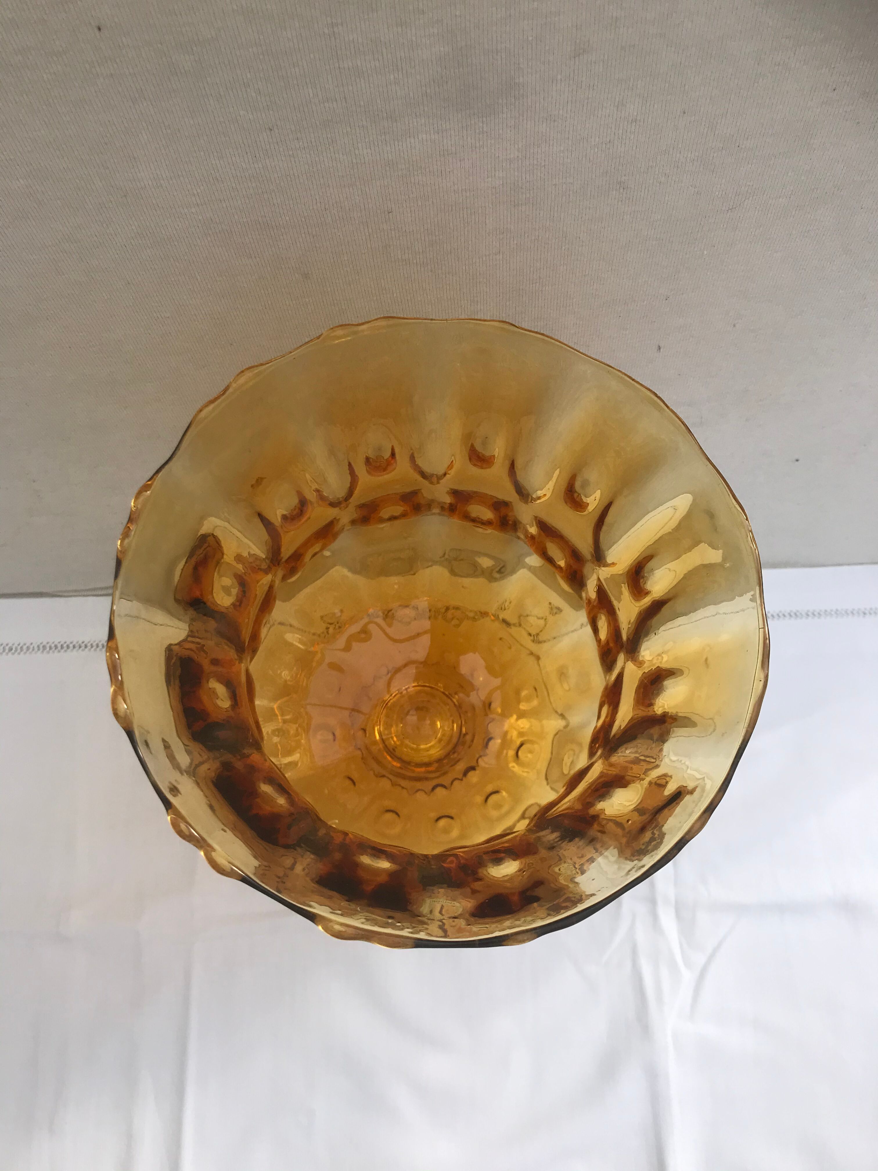 Ancient vase on foot orange glass