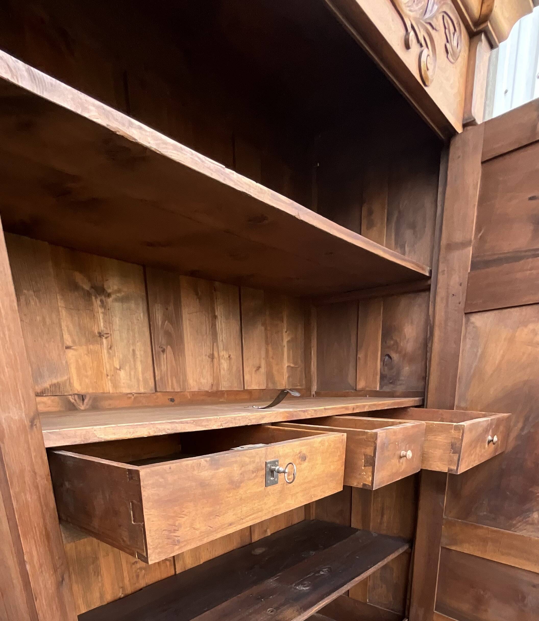 Empire wardrobe in solid walnut, France, mid-19th century.