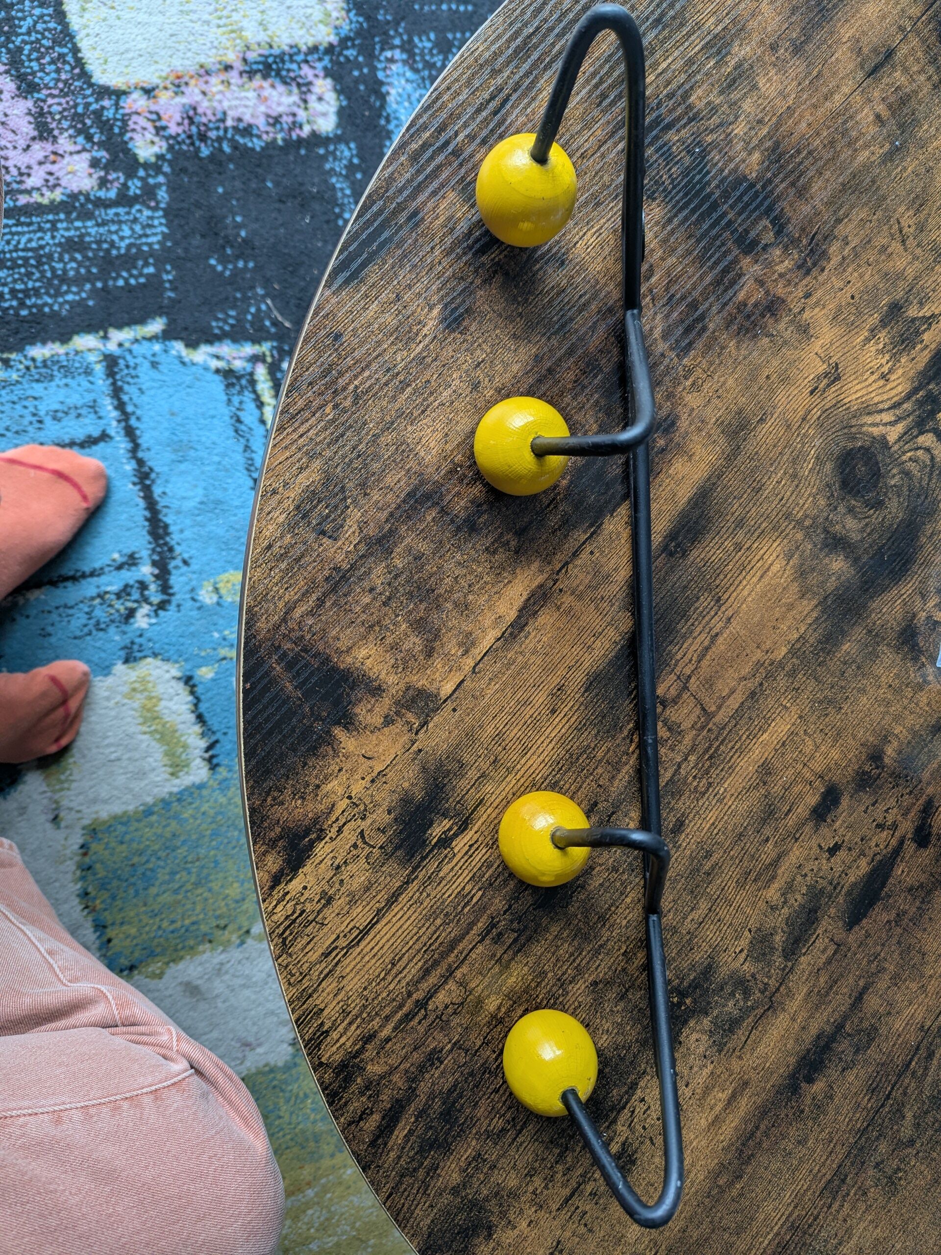 Vintage coat rack Roger Feraud with 4 yellow ball hooks.