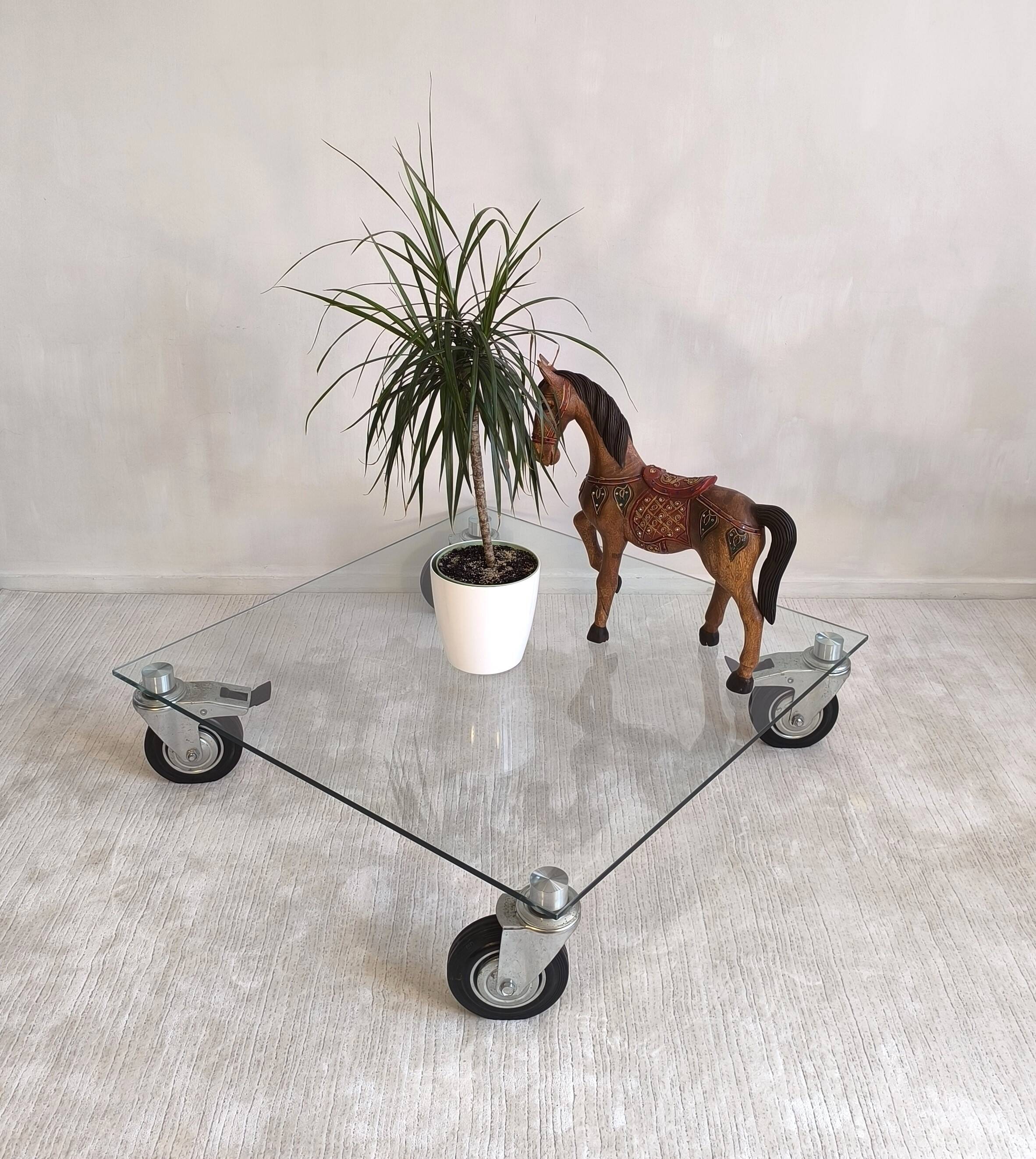 Beautiful designer glass coffee table on wheels