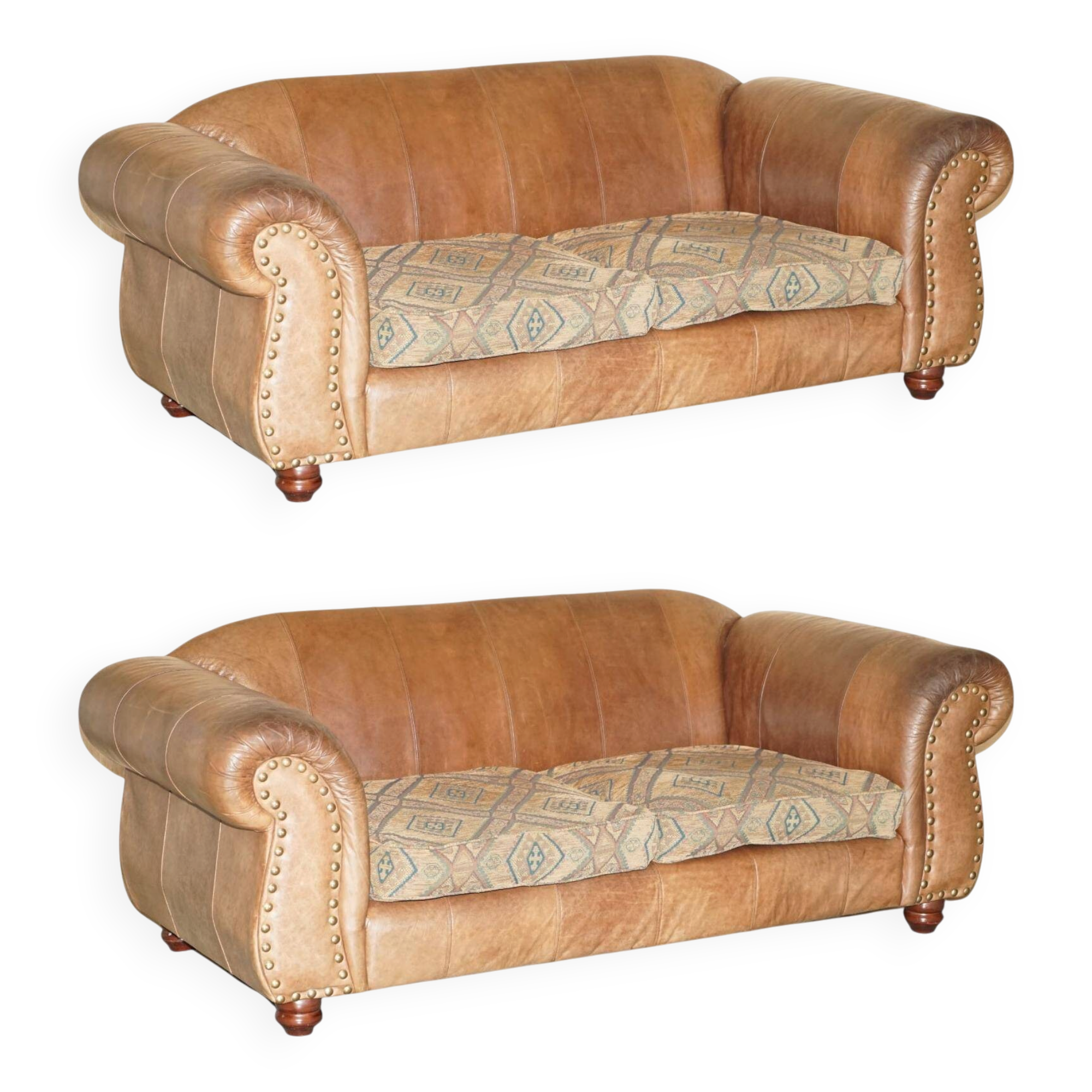 Vintage leather sofas by Thomas Lloyd with Kilim cushions.
