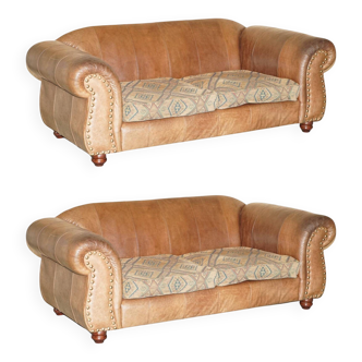Vintage leather sofas by Thomas Lloyd with Kilim cushions.