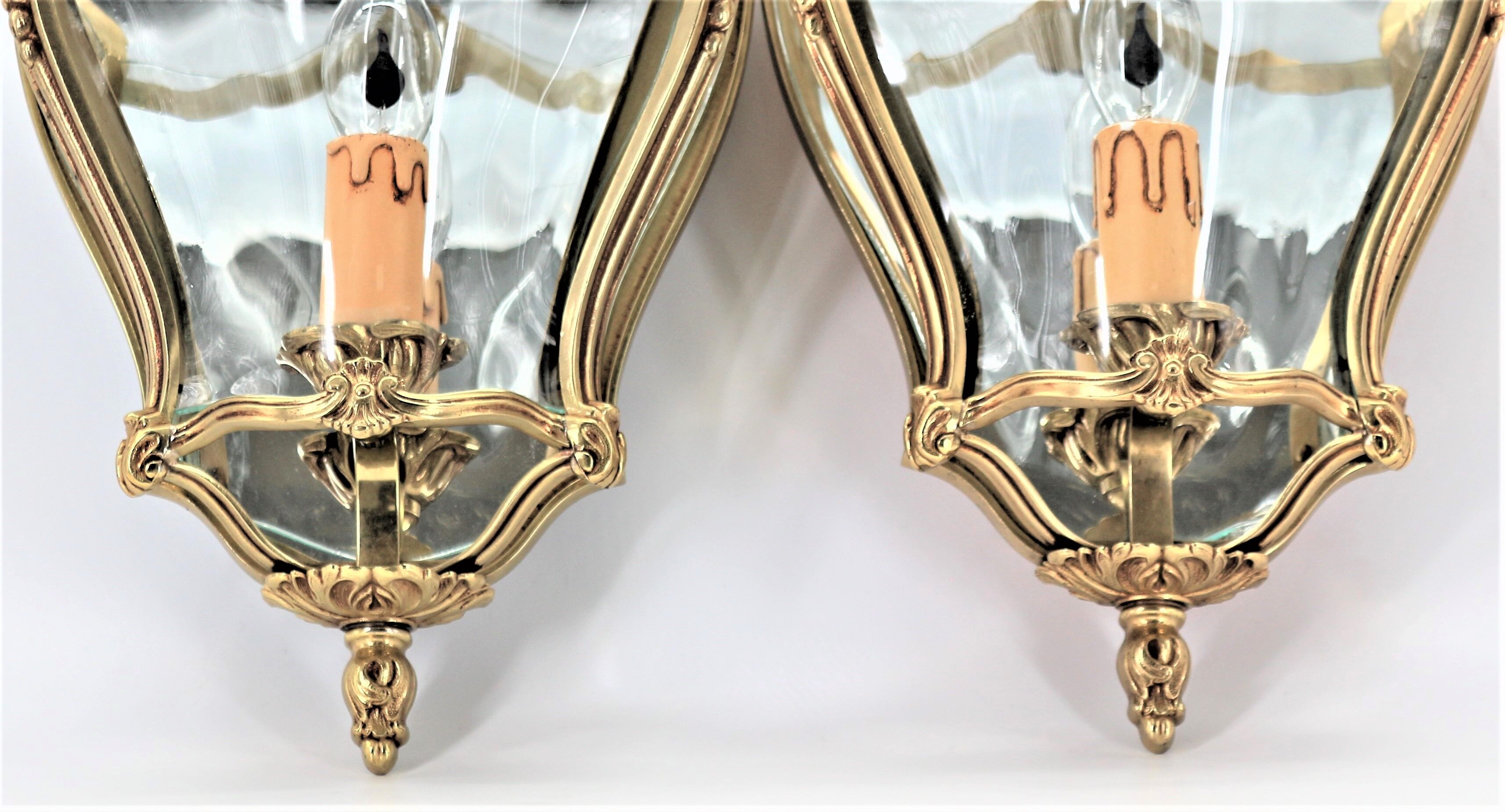 Pair of Louis XV style appliques in solid bronze & curved glass