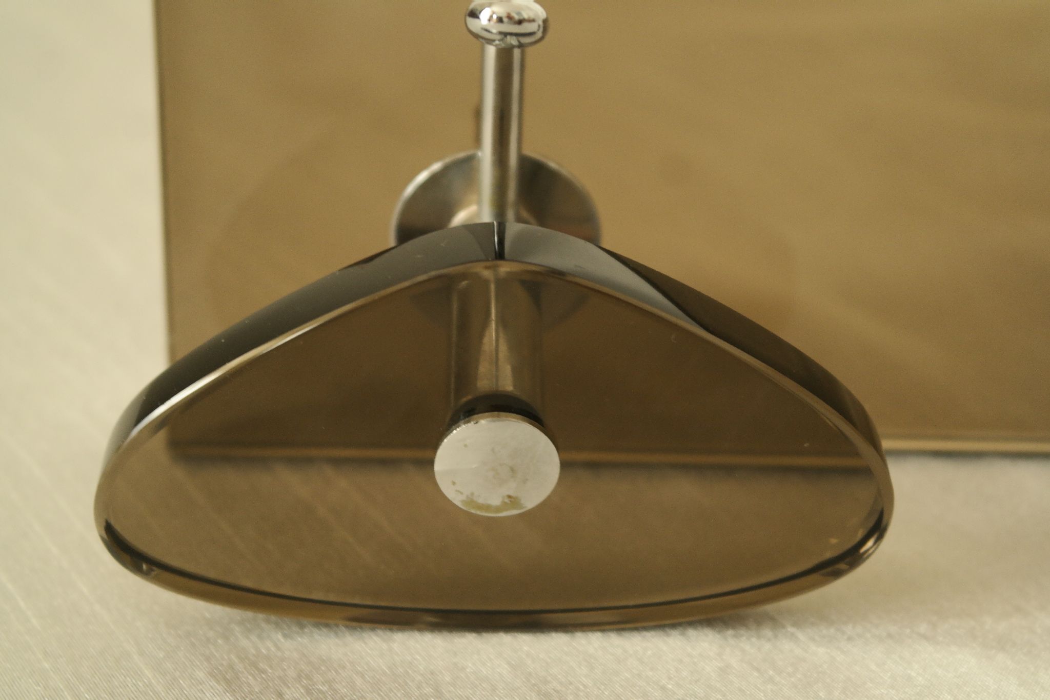 Brown smoked glass coat hook from the 1970s.