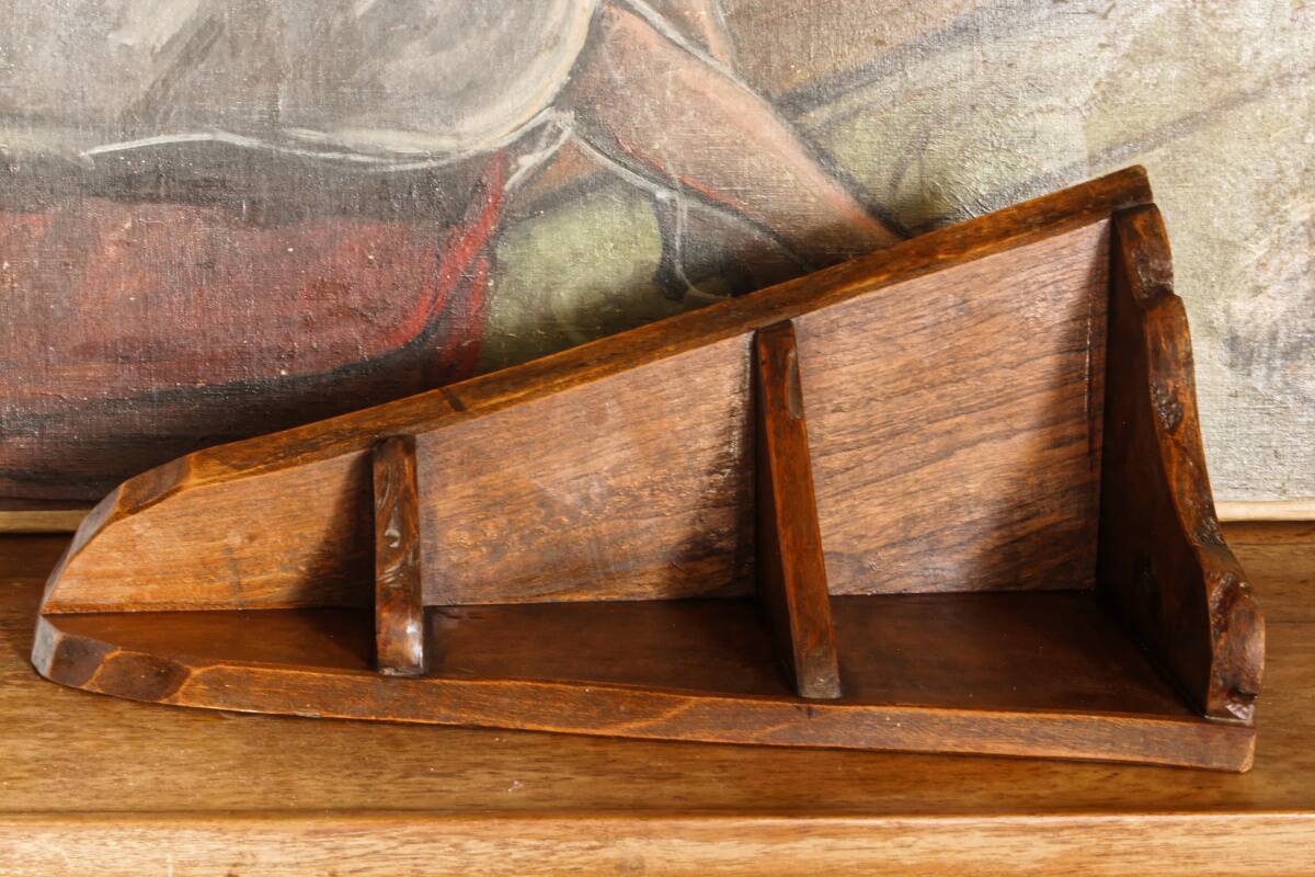 Small brutalist corner shelf in solid oak.