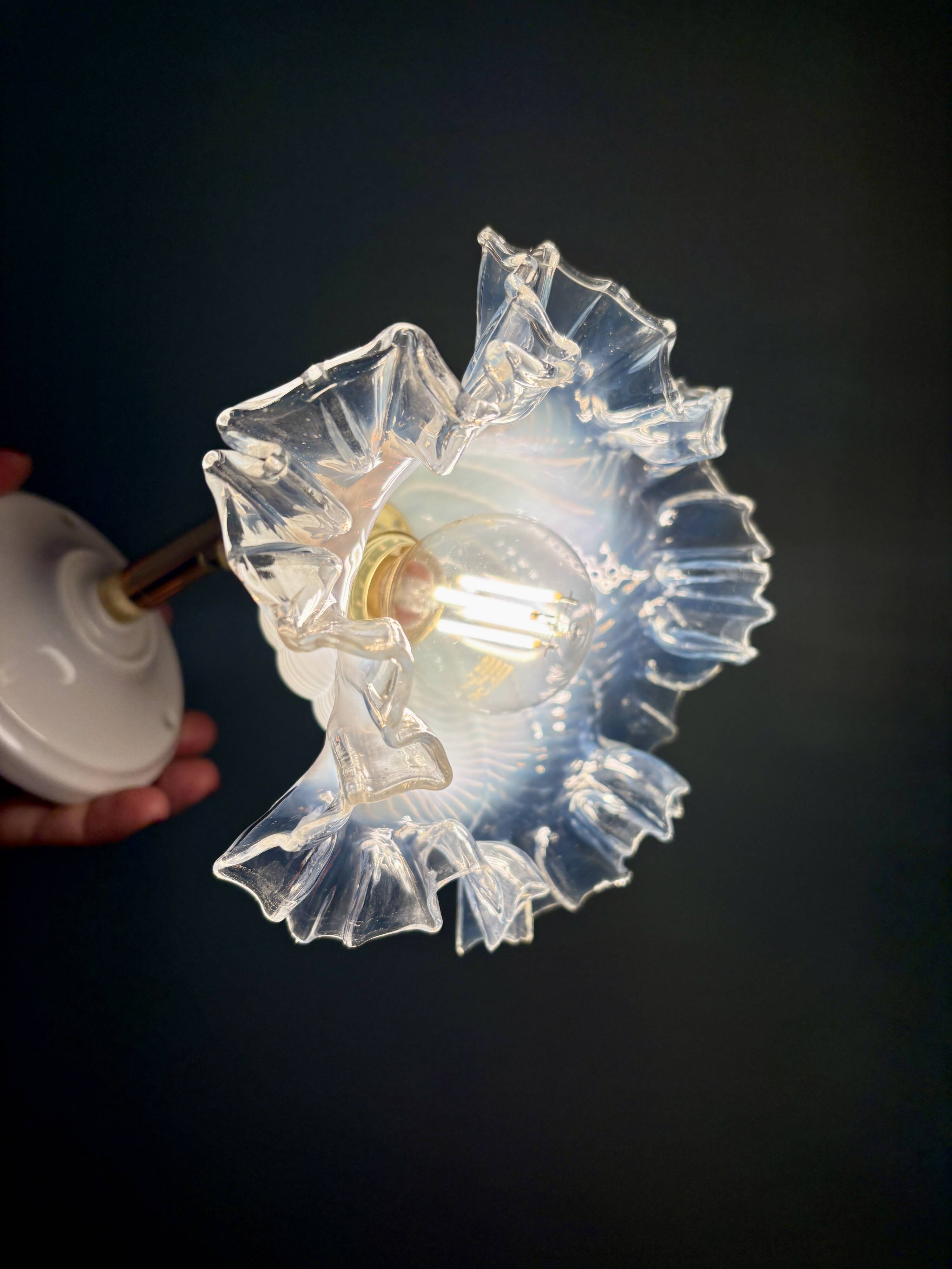 Vintage tulip glass wall light in transparent, slightly pearlescent white.