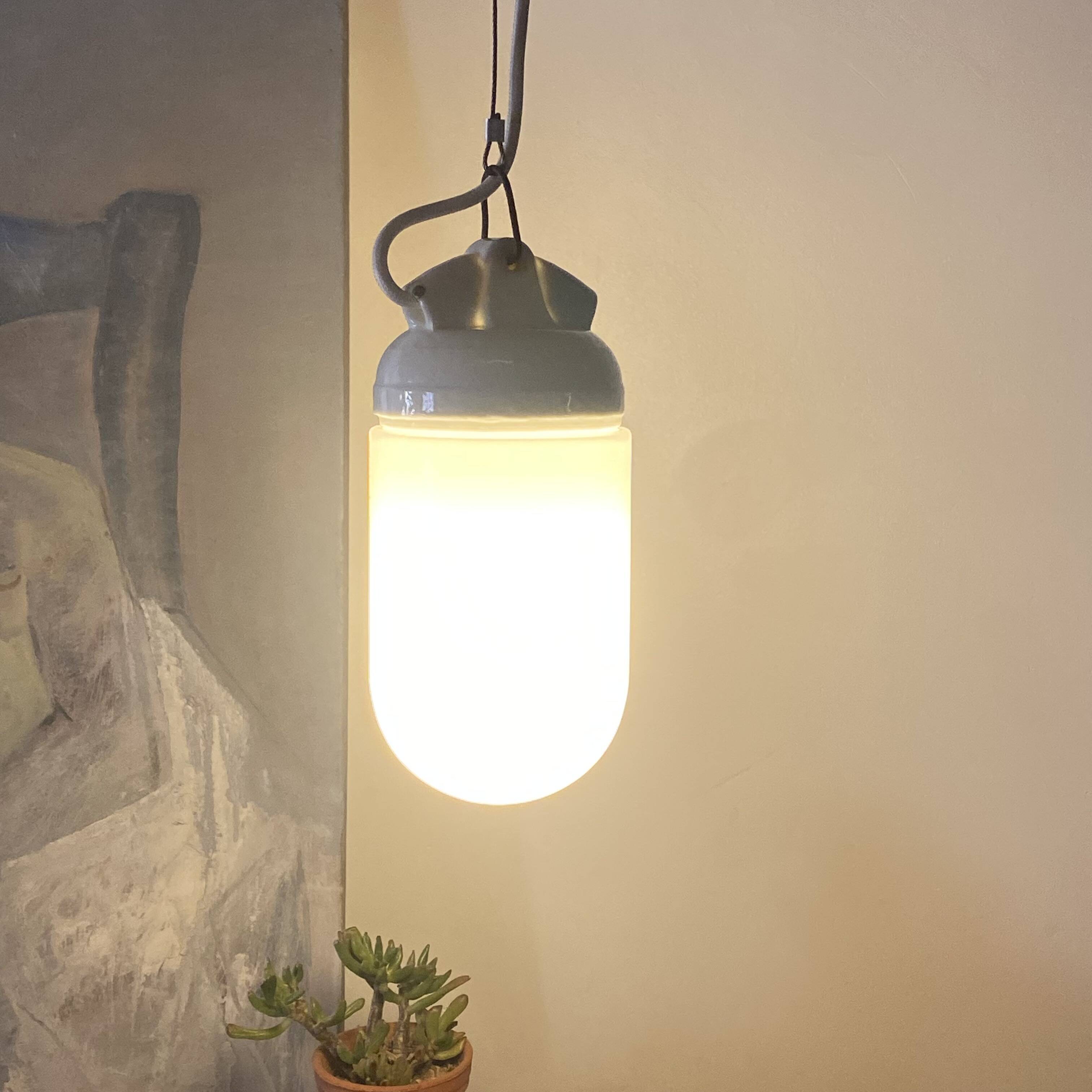 Industrial suspension in white glass and porcelain, vintage model.