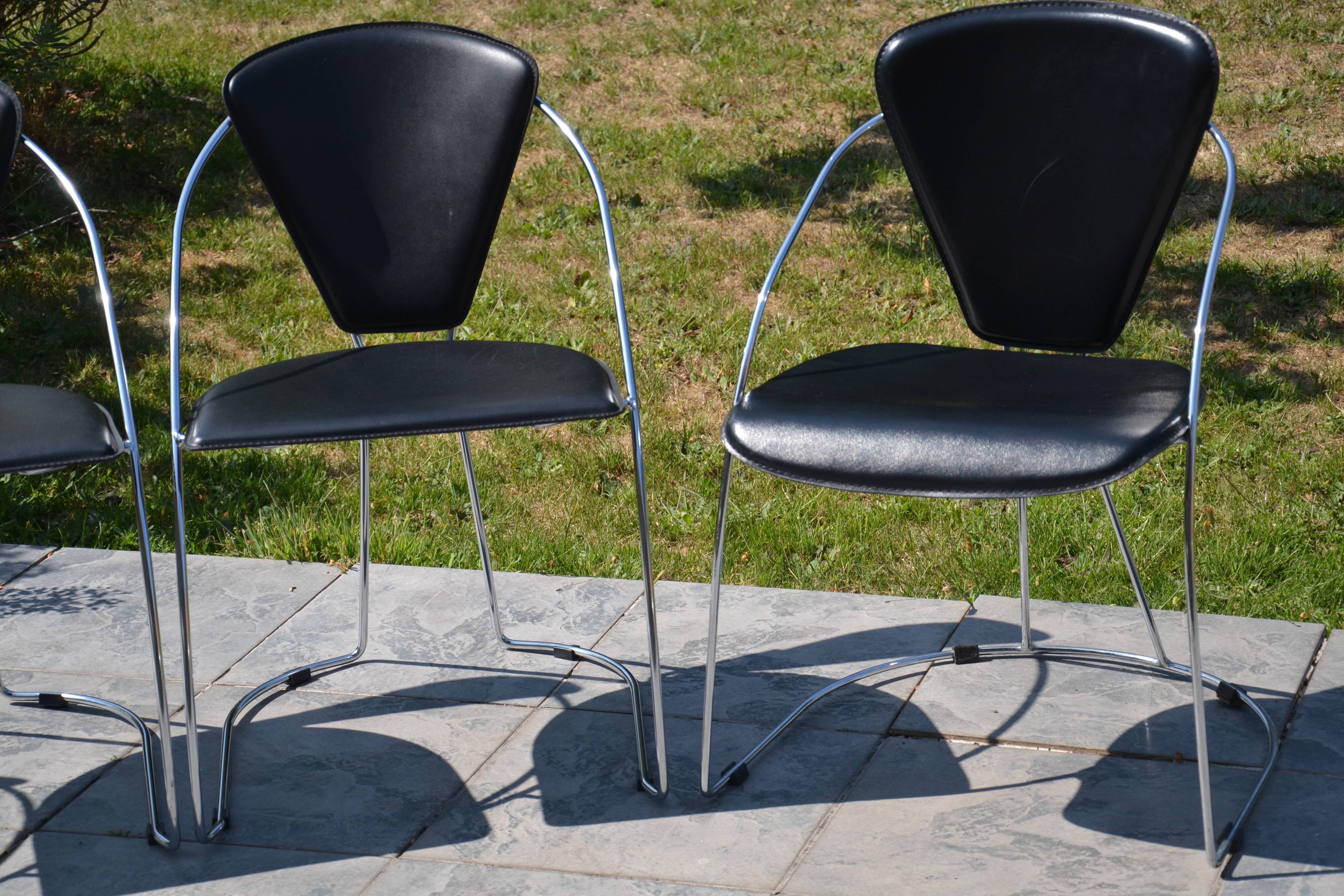 4 chrome and leather chairs designed by Italy