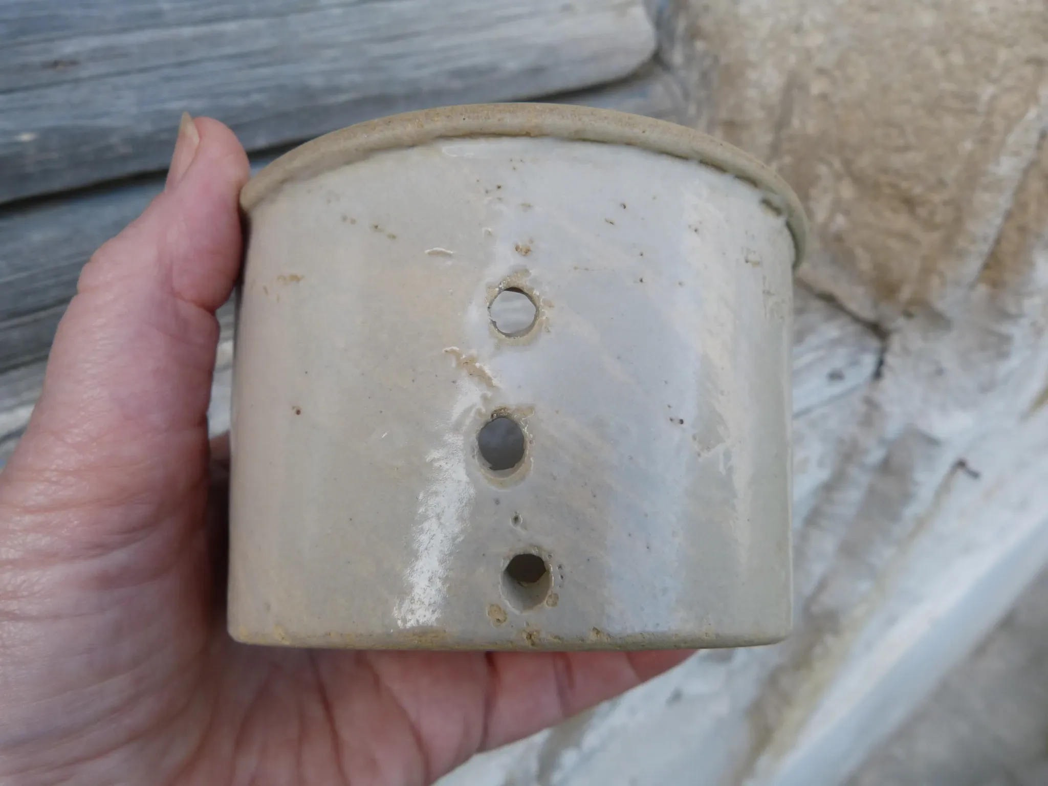 Beige stoneware cheese drainer