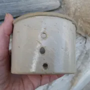 Beige stoneware cheese drainer