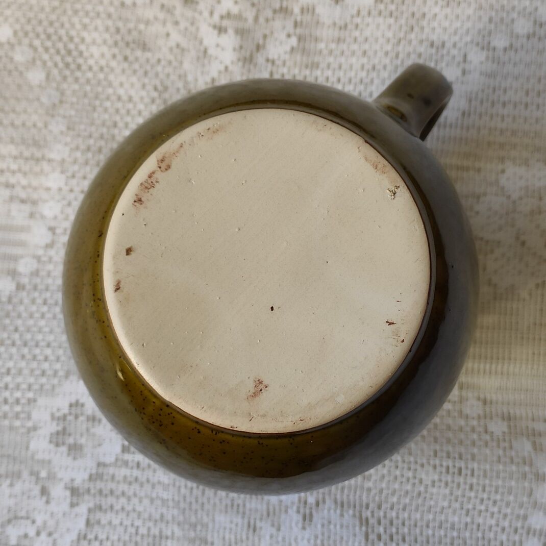 Green ceramic pitcher