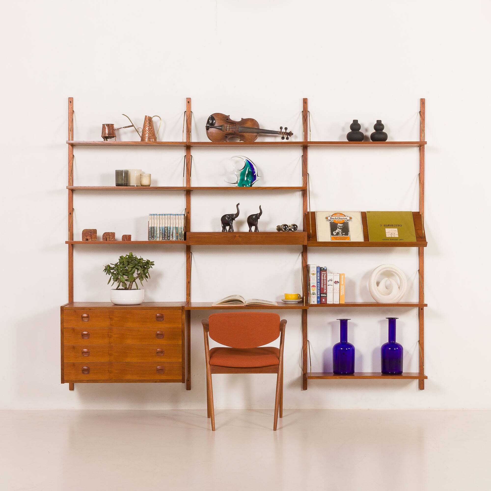 Danish teak wall unit in the style of Cadovius, Sorensen with a lamp, 1970s