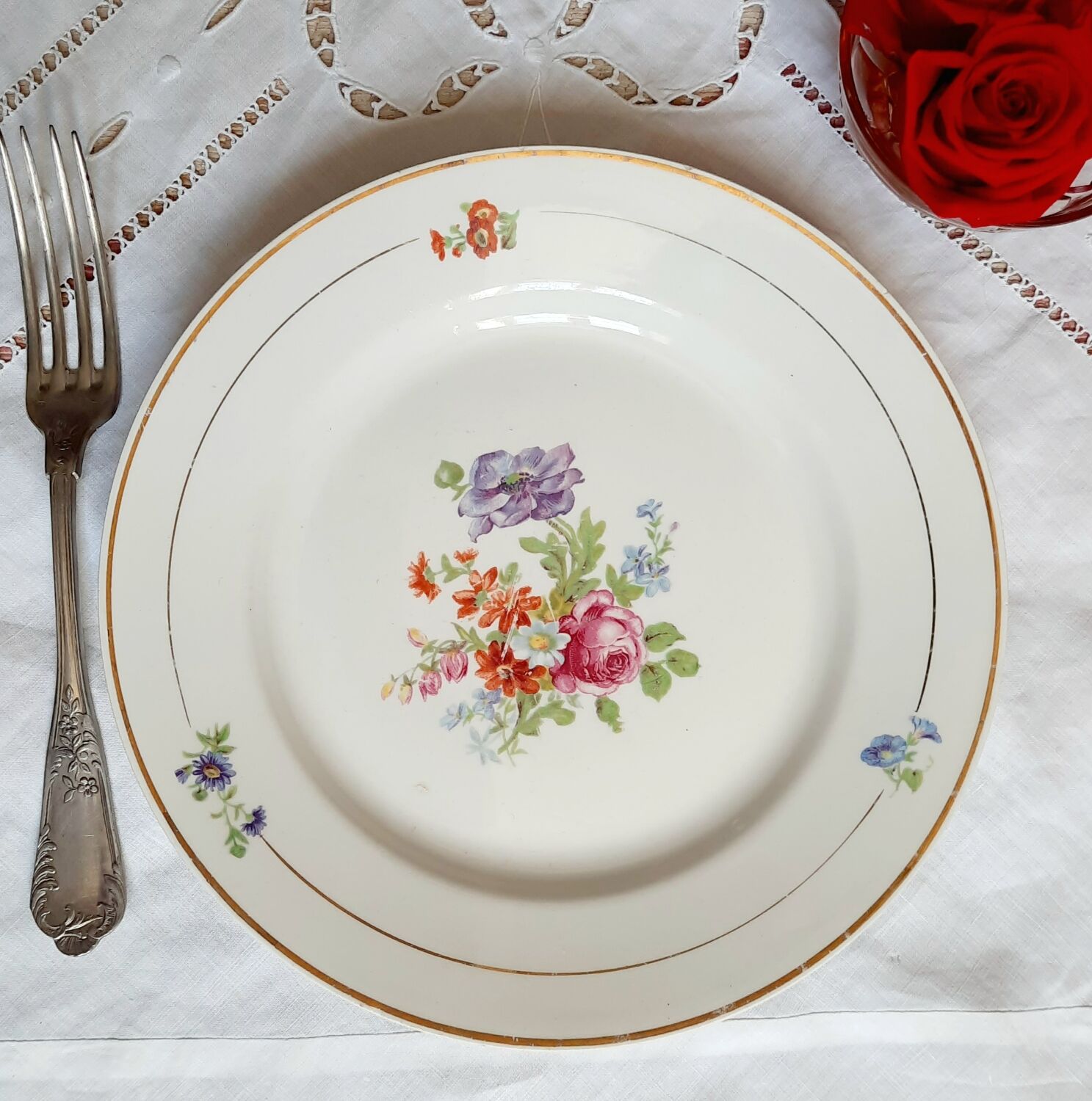 Flat antique earthenware plates with gilded edges