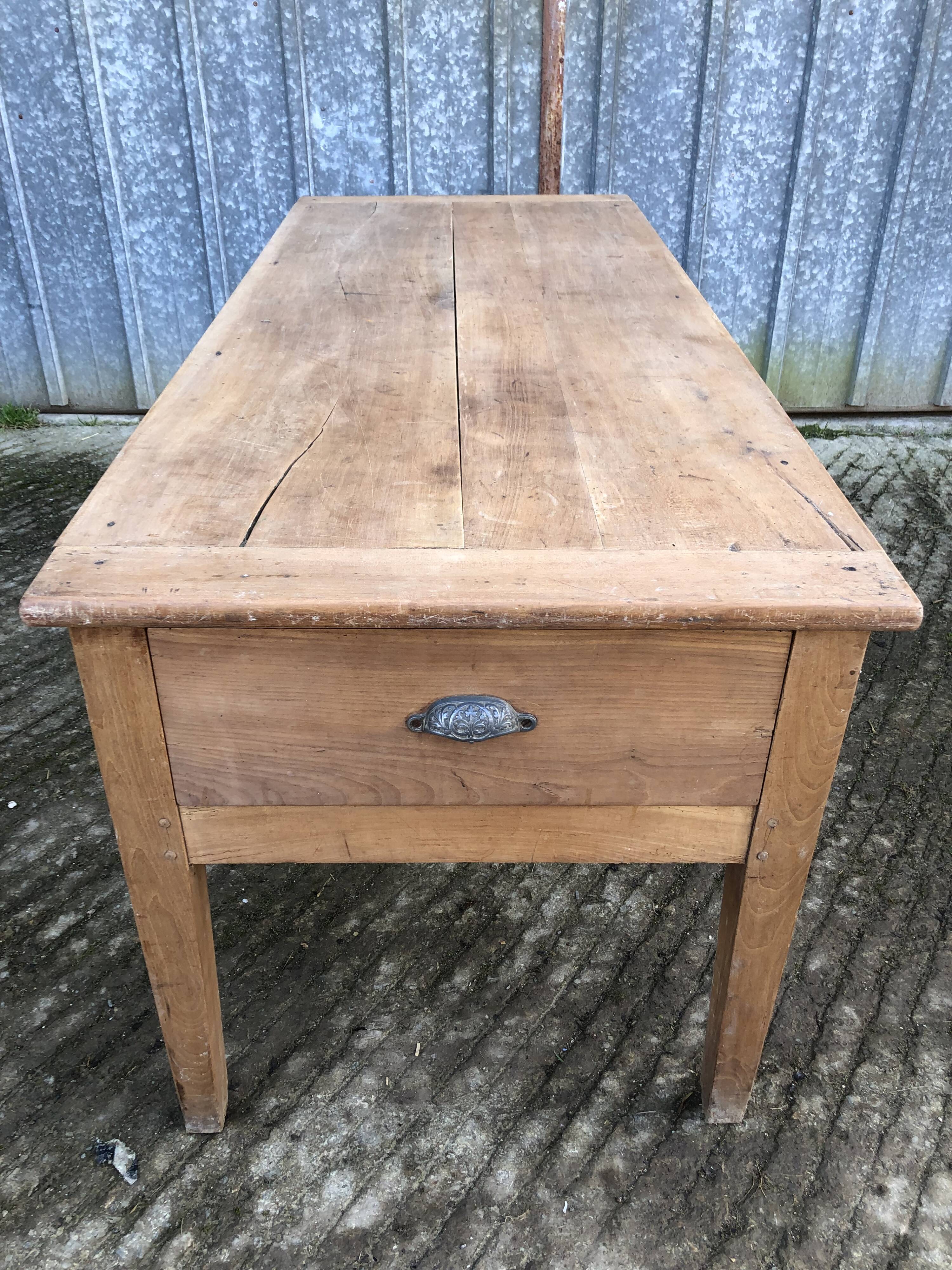 Antique solid cherry farmhouse table with 3 drawers and 1 pull out.
