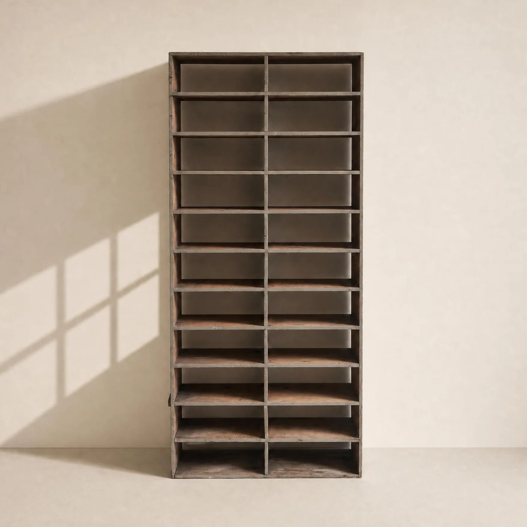 Large antique workshop cabinet with patinated wooden compartments, 20th century.