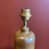 "Stoneware Bottle Lamp" with a multicoloured blue lampshade handwoven in India.