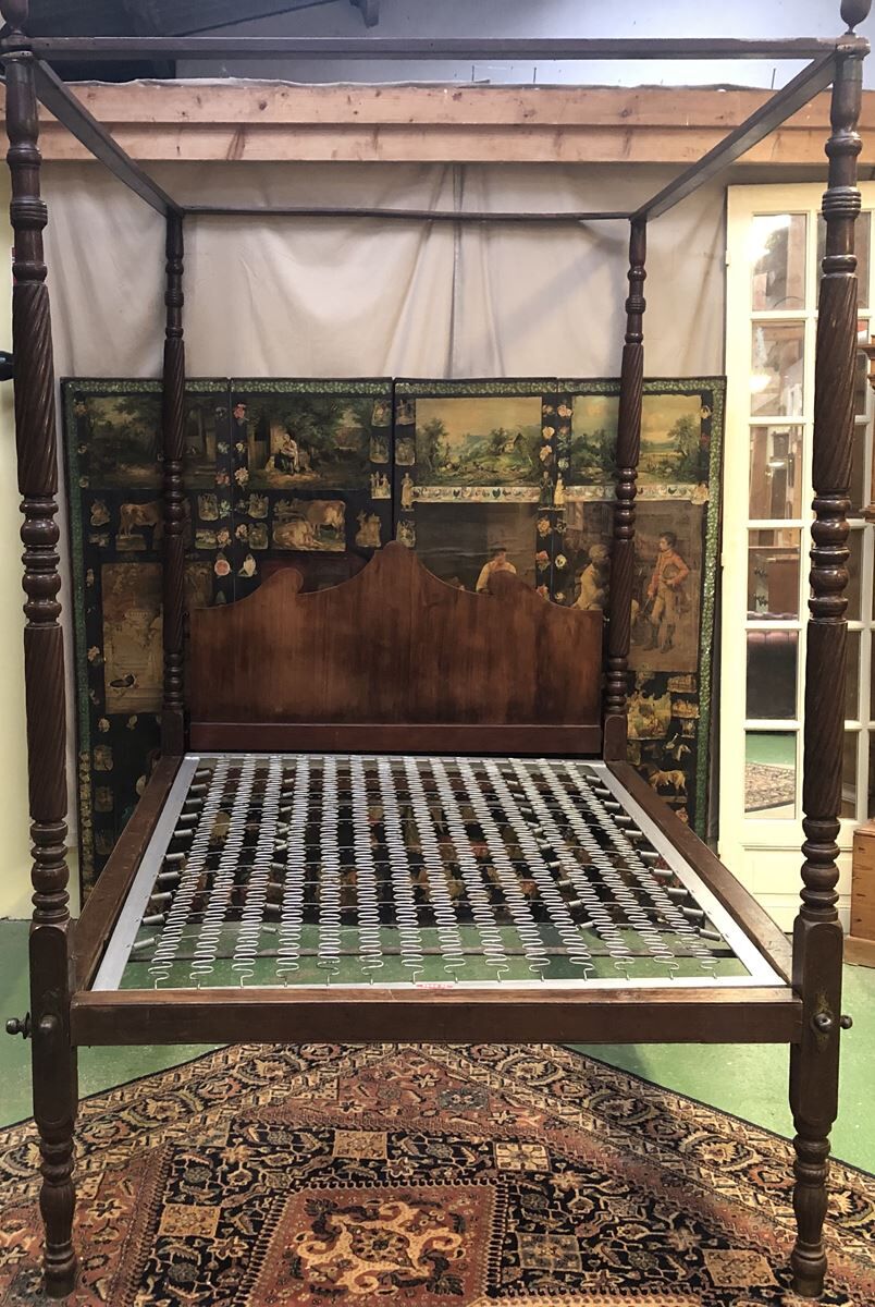 Four-poster bed in late 19th century mahogany