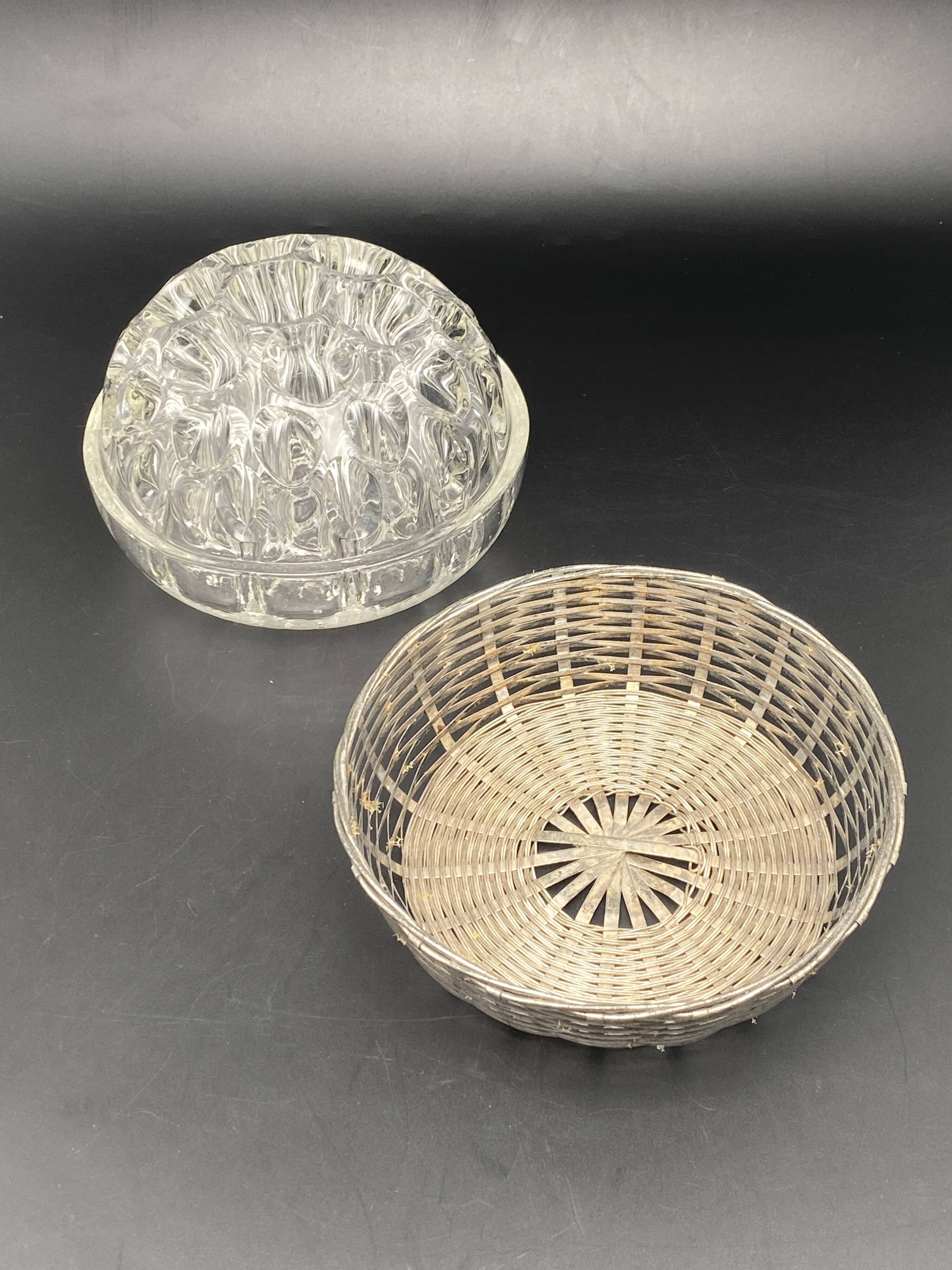 Glass flower stand with woven metal support