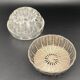 Glass flower stand with woven metal support