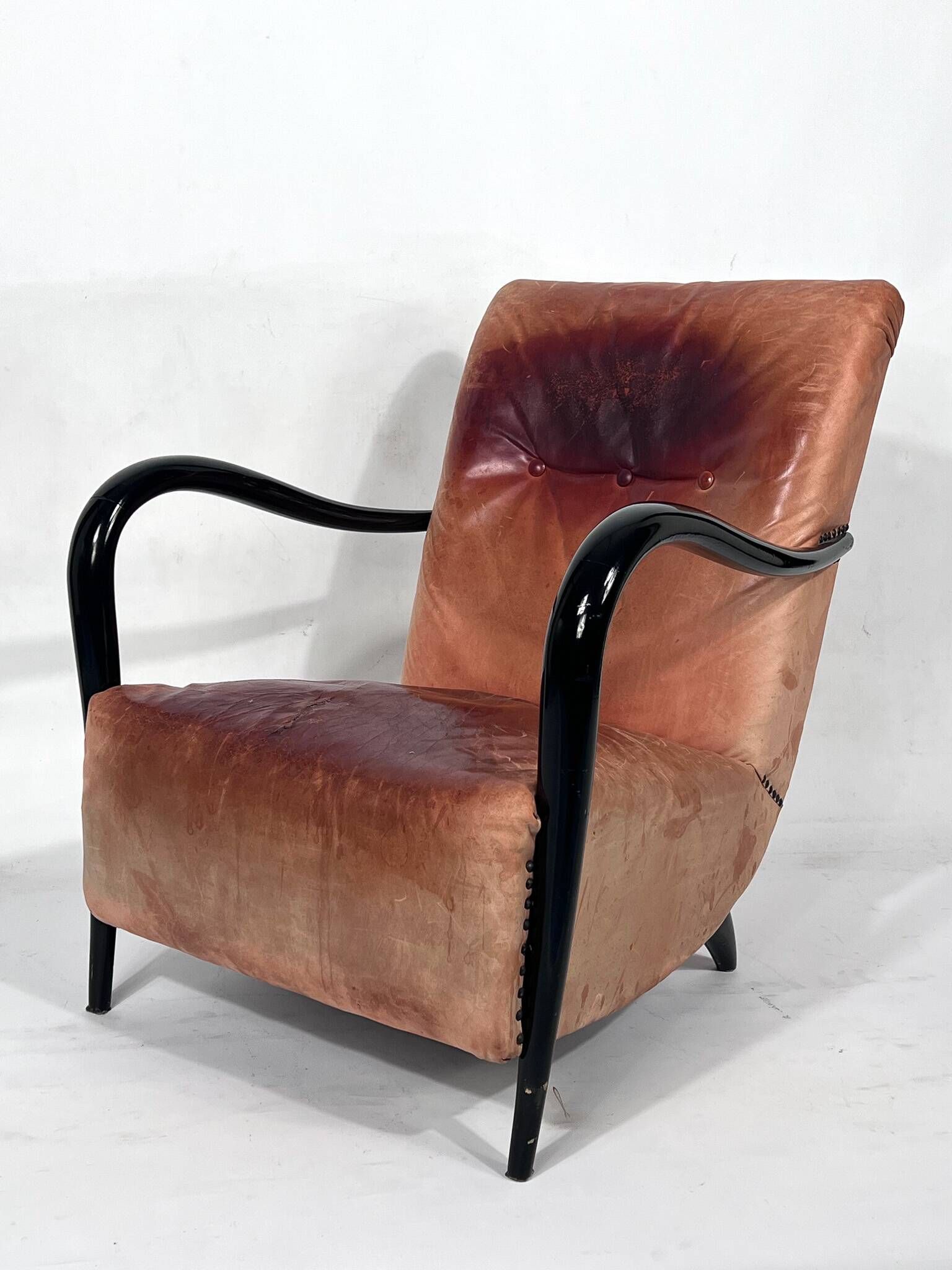 Sculptural Italian Mid-century leather and curved wood armchair from 50s