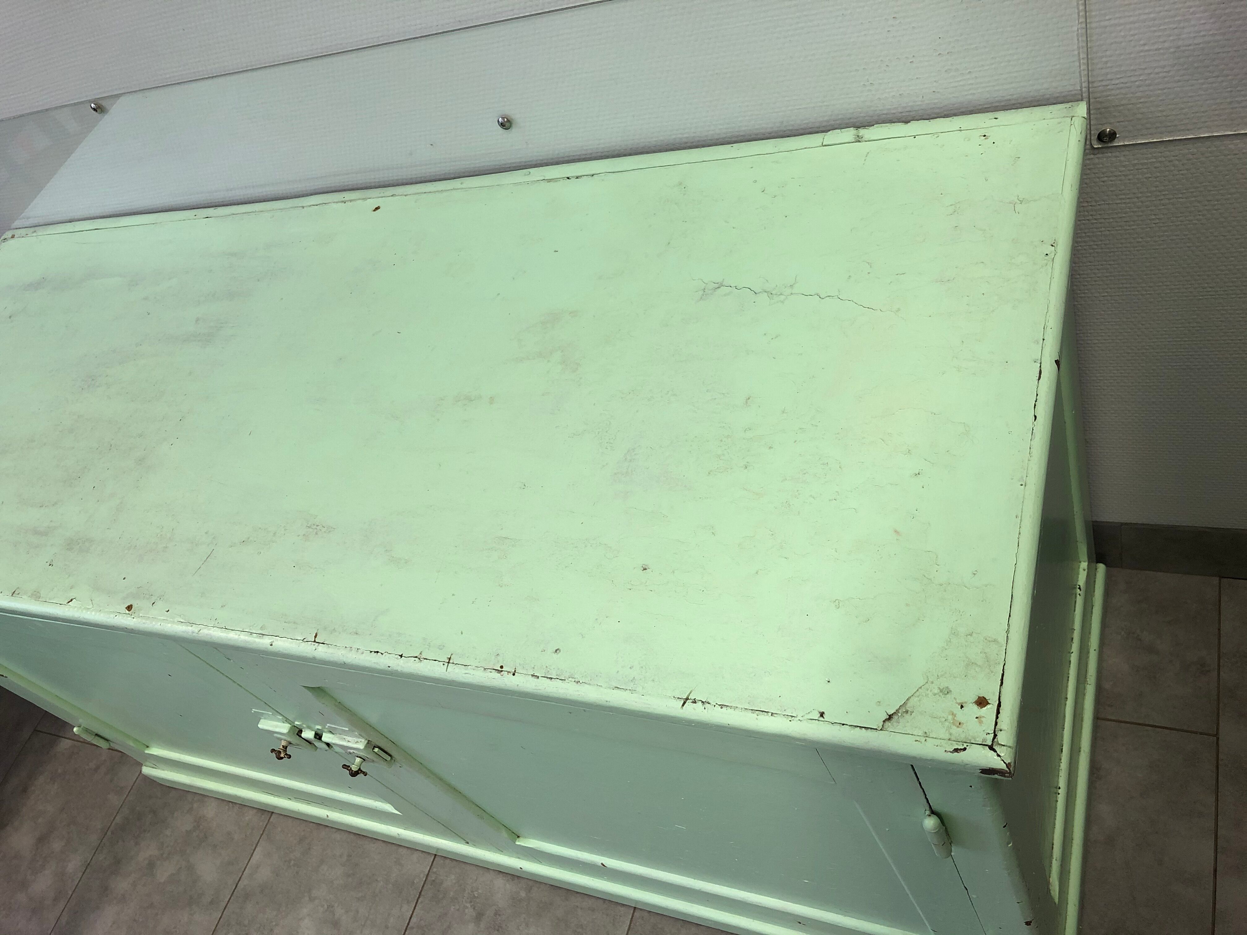 Low green patinated furniture