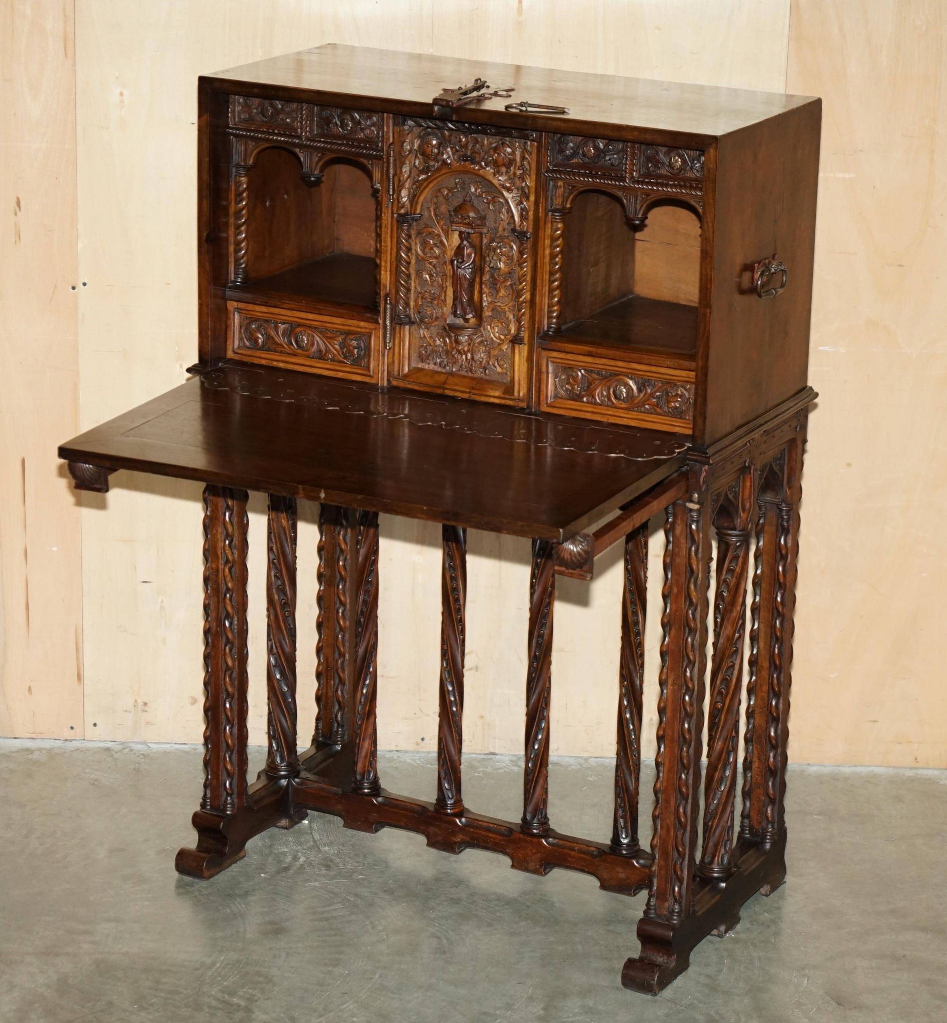 18th-century carved Spanish cabinet with hidden storage.