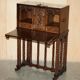 Cabinet espagnol sculpté 18ème siècle avec rangement caché
