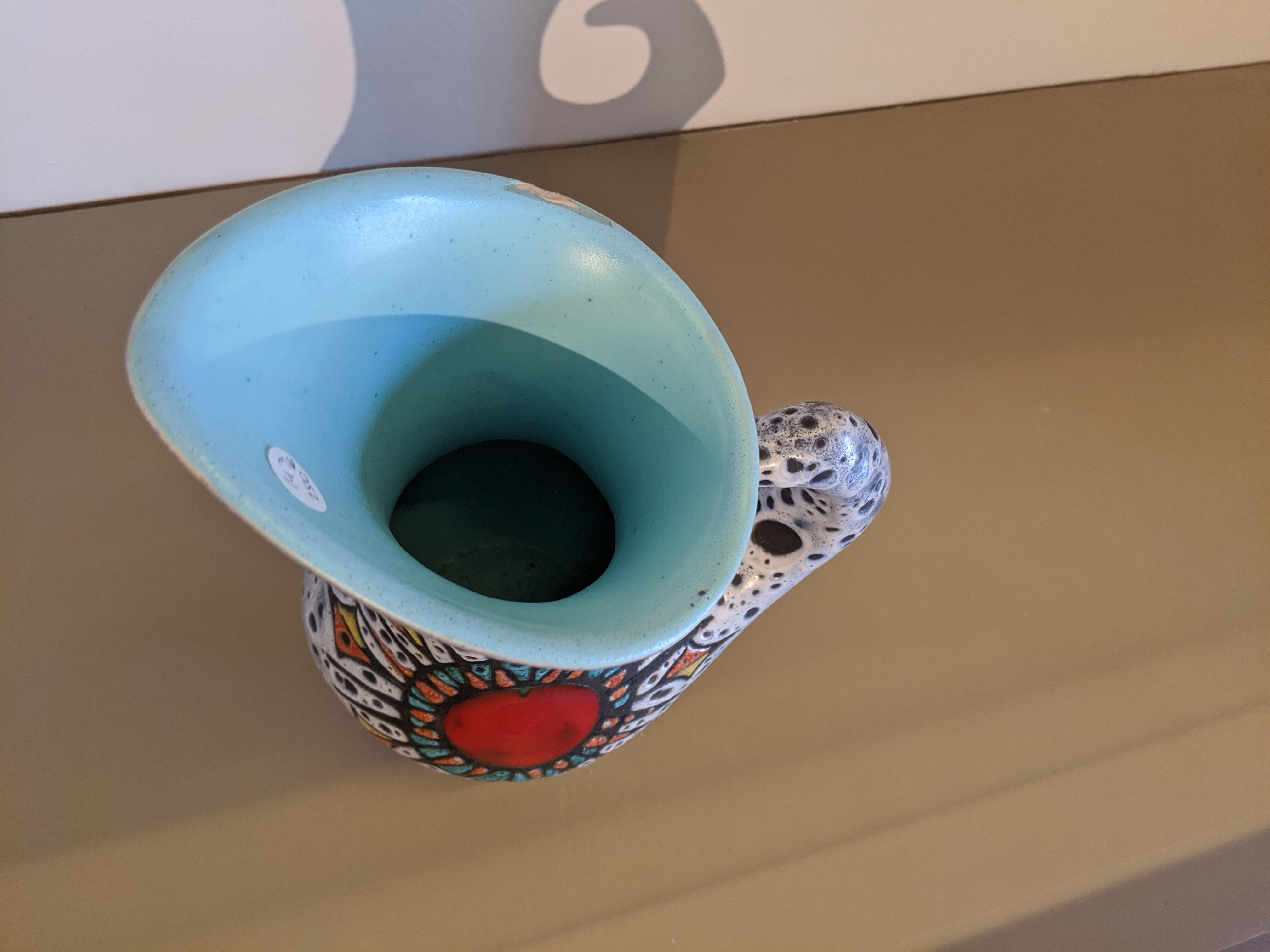 Granite ceramic pitcher and heart symbol