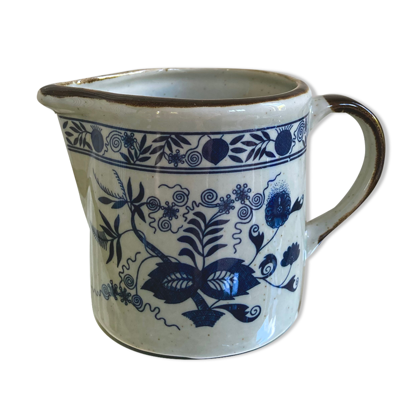 Stoneware milk jug with flower decoration