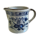 Stoneware milk jug with flower decoration