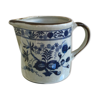 Stoneware milk jug with flower decoration