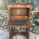 A small piece of Bonheur du jour with detached columns in Empire-era mahogany.
