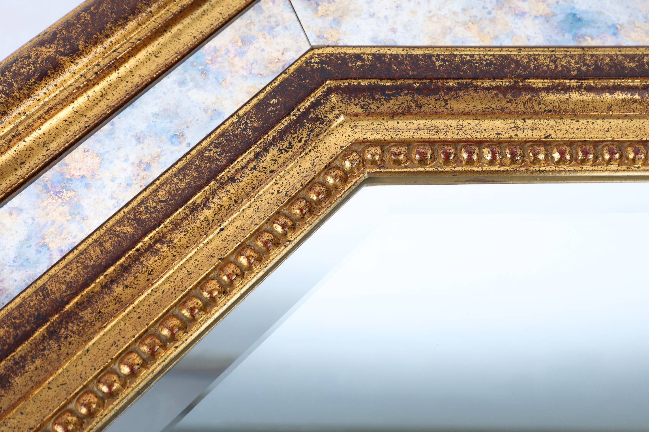 Gilded octagonal mirror by Deknudt Belgium decorated with smoked mirror gla