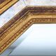 Gilded octagonal mirror by Deknudt Belgium decorated with smoked mirror gla