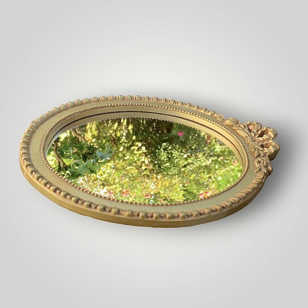 Antique small round wall mirror in gold resin - love knot